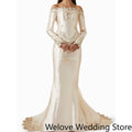 Ivory Victorian‑Style Bridal Wedding Gown with Off‑Shoulder Neckline, Long Sleeves, Structured Corset Bodice with Front Bow