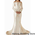 Ivory Victorian‑Style Bridal Wedding Gown with Off‑Shoulder Neckline, Long Sleeves, Structured Corset Bodice with Front Bow - Luzilly Bridal & Apparel